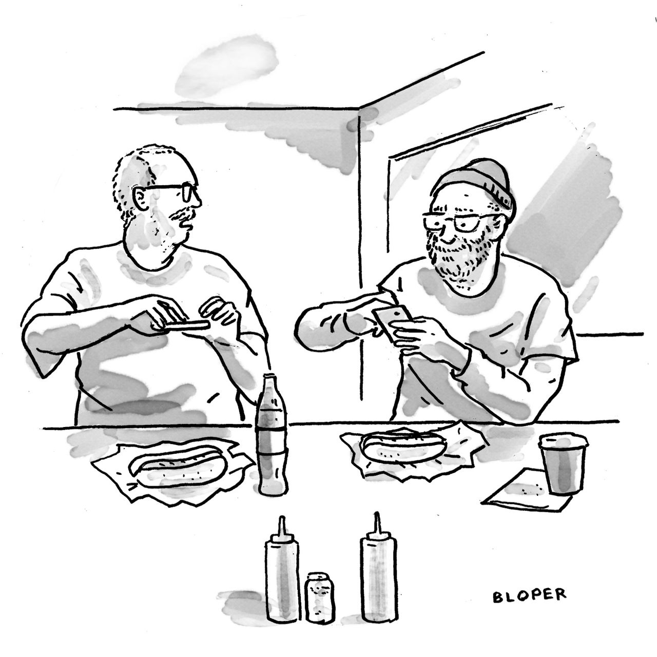 Two people at a bar take photos of hot dogs.